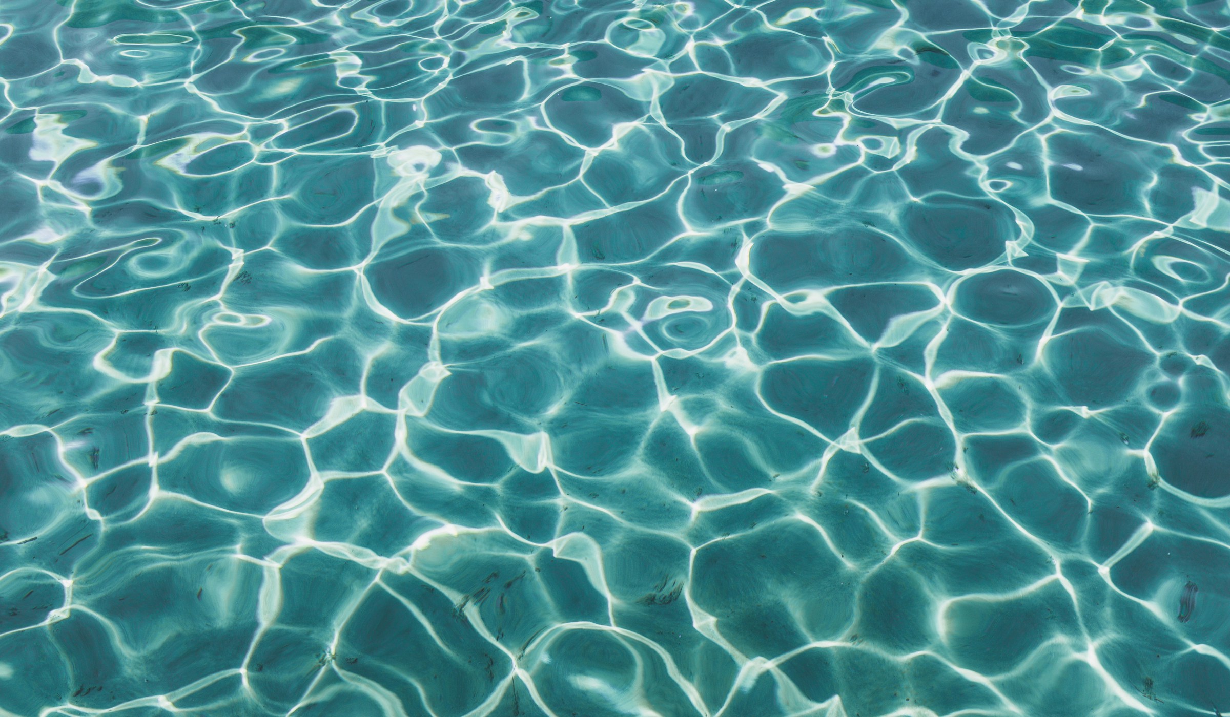 Sunlight reflecting through clear turquoise water